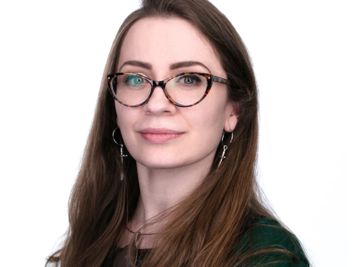 Headshot of young girl with glasses