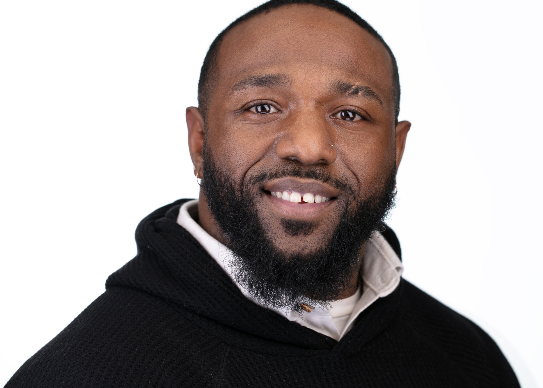 Headshot of man wearing sweater