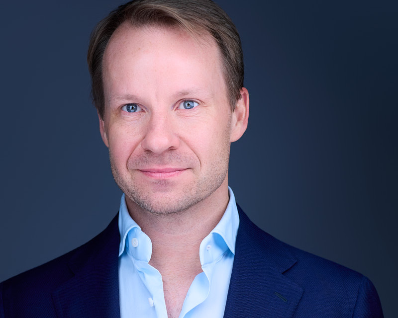 Professional ERAS headshot of President and Chief Operating Officer at Flynn Group by DeMayne Earvin of The Headshot Experience in Cleveland, Ohio